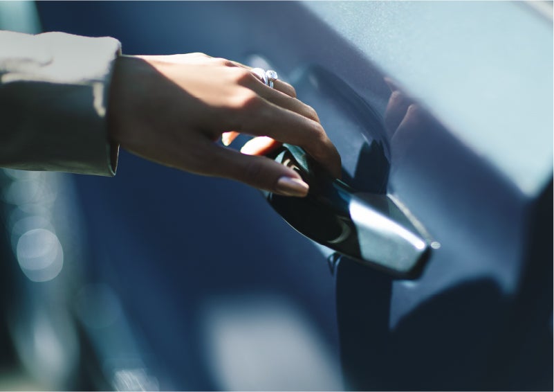 A hand gracefully grips the Light Touch Handle of a 2023 Lincoln Aviator® SUV to demonstrate its ease of use | Lincoln of Coconut Creek in Coconut Creek FL