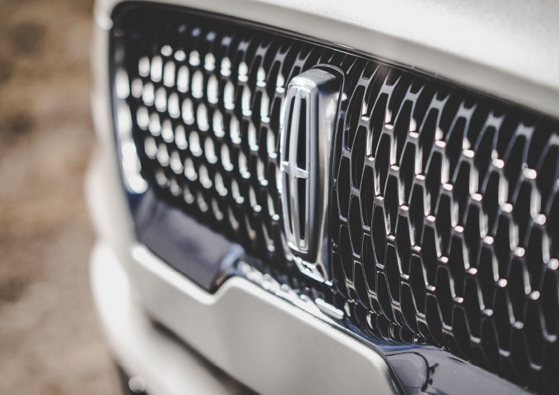 The grille of the 2024 Lincoln Aviator® Reserve model with an eye-catching repeated field of Lincoln Star logo shapes | Lincoln of Coconut Creek in Coconut Creek FL