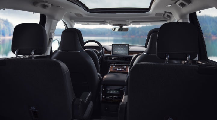 The interior of a 2024 Lincoln Aviator® SUV from behind the second row | Lincoln of Coconut Creek in Coconut Creek FL