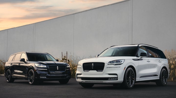 Two Lincoln Aviator® SUVs are shown with the available Jet Appearance Package | Lincoln of Coconut Creek in Coconut Creek FL