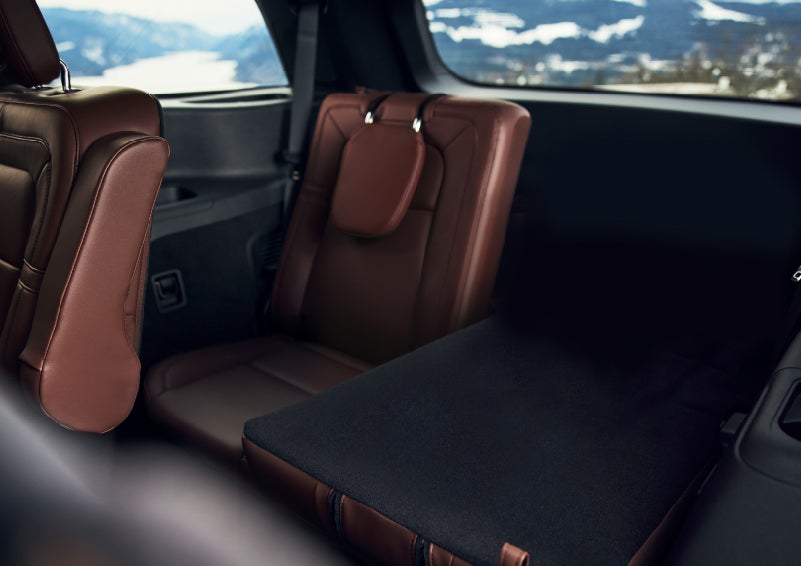 The left rear seat of a 2024 Lincoln Aviator® SUV is shown folded flat for additional cargo space | Lincoln of Coconut Creek in Coconut Creek FL