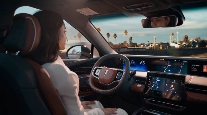 A person is shown driving hands-free on the highway with available Lincoln BlueCruise technology. | Lincoln of Coconut Creek in Coconut Creek FL