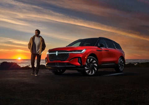 A person is shown next to a 2024 Lincoln Nautilus® SUV as the Lincoln Embrace sequence takes place. | Lincoln of Coconut Creek in Coconut Creek FL