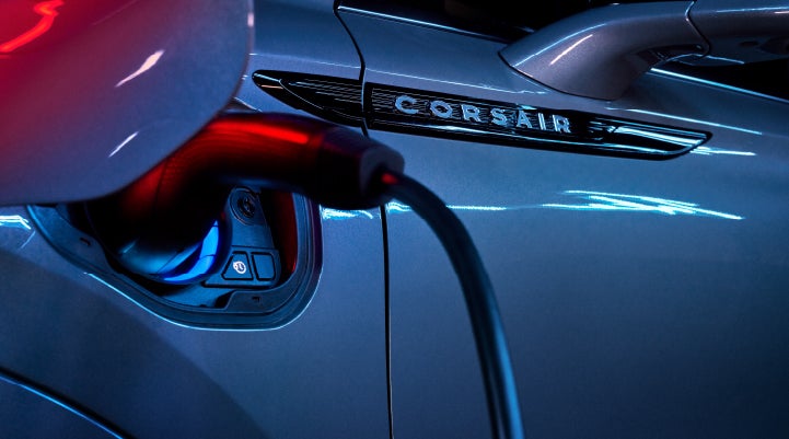 A charger plugged into the charging port of a 2024 Lincoln Corsair® Plug-in Hybrid model. | Lincoln of Coconut Creek in Coconut Creek FL